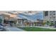 The town center features casual outdoor seating, shops, restaurants, and an artificial lawn for  at 6510 Honeymeade Cir, Charlotte, NC 28277