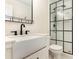 Bathroom featuring a black framed shower, toilet, and a stylish vanity sink with black hardware at 6639 Camp Creek Rd, Lancaster, SC 29720