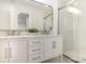 Bathroom featuring double vanity, framed mirror, marble countertop and tiled walk-in shower at 6639 Camp Creek Rd, Lancaster, SC 29720