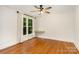 Bedroom with wood flooring, a ceiling fan, neutral colors and large windows at 6639 Camp Creek Rd, Lancaster, SC 29720
