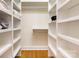Walk-in closet featuring custom shelving, offering ample space for clothing and accessories at 6639 Camp Creek Rd, Lancaster, SC 29720