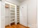Spacious walk-in closet with custom shelving for ample storage and organization at 6639 Camp Creek Rd, Lancaster, SC 29720