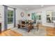Dining area featuring hardwood floors, natural light, and a dining table for six at 6639 Camp Creek Rd, Lancaster, SC 29720