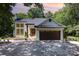 Charming painted-brick home featuring a two-car garage, and a welcoming front porch at 6639 Camp Creek Rd, Lancaster, SC 29720