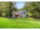 Well-manicured lawn and garden surround this home, adding to its curb appeal and natural beauty at 6639 Camp Creek Rd, Lancaster, SC 29720