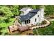 Aerial view of a home with a spacious wooden deck, featuring meticulous landscaping at 6639 Camp Creek Rd, Lancaster, SC 29720