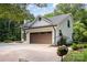 Charming home with a brown garage door, featuring lovely landscaping and a well-maintained driveway at 6639 Camp Creek Rd, Lancaster, SC 29720