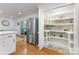 Kitchen with a large pantry, stainless steel fridge, and eat-in area at 6639 Camp Creek Rd, Lancaster, SC 29720