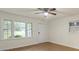Bright bedroom featuring a large window, wood floors, and ample closet space at 818 Stowe Ln, Gastonia, NC 28056