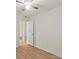 An empty bedroom with light walls, light wood floors, and an open doorway at 818 Stowe Ln, Gastonia, NC 28056
