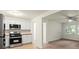 Updated kitchen features white cabinets, stainless appliances, and wood countertops at 818 Stowe Ln, Gastonia, NC 28056