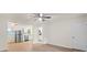 Bright living room with wood floors opens to kitchen with stainless appliances at 818 Stowe Ln, Gastonia, NC 28056