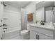 Clean bathroom with a shower and tub, white fixtures, and sleek vanity at 889 Exeter Dr, Sherrills Ford, NC 28673