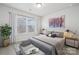 Bright bedroom featuring a large window, stylish decor, and modern furnishings at 889 Exeter Dr, Sherrills Ford, NC 28673