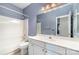 Bathroom with a vanity, toilet, and shower-tub combo at 9419 Olivia Ln, Charlotte, NC 28277