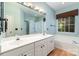 Bathroom with double sink vanity, soaking tub, and separate shower at 9419 Olivia Ln, Charlotte, NC 28277