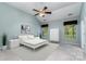 Stylish bedroom showcasing high ceilings, ceiling fan, and sleek minimalist decor for a modern aesthetic at 9419 Olivia Ln, Charlotte, NC 28277