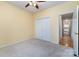 Bedroom features a closet and view to hallway and possible ensuite at 9419 Olivia Ln, Charlotte, NC 28277