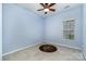 Cozy bedroom with ceiling fan and window allowing in natural light at 9419 Olivia Ln, Charlotte, NC 28277