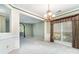 Dining room featuring a modern chandelier and abundant natural light at 9419 Olivia Ln, Charlotte, NC 28277