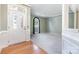 Bright foyer with a leaded glass door and views into the formal living spaces at 9419 Olivia Ln, Charlotte, NC 28277