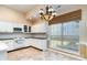 Functional kitchen with classic cabinets, tile floors, and abundant natural light at 9419 Olivia Ln, Charlotte, NC 28277