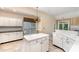 Bright kitchen featuring white cabinets, center island, and eat-in area bathed in natural light at 9419 Olivia Ln, Charlotte, NC 28277