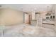 Open-concept living area with adjacent kitchen and dining space offers lots of natural light at 9419 Olivia Ln, Charlotte, NC 28277