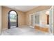 Bright office with an arched window and glass paneled doors at 9419 Olivia Ln, Charlotte, NC 28277