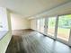 Inviting living room with wood-look flooring and large glass doors providing natural light at 9541 Shannon Green Dr # C, Charlotte, NC 28213