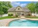 Lovely backyard featuring a pool, patio, and a well-maintained lawn perfect for outdoor enjoyment at 1009 Jerry Ln, Matthews, NC 28105