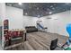 Basement game room with galaxy themed ceiling, hardwood floors, and modern games at 1009 Jerry Ln, Matthews, NC 28105