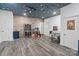 Finished basement with wood flooring, gaming area, and fun ceiling design at 1009 Jerry Ln, Matthews, NC 28105