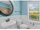 Charming bathroom featuring a vessel sink, decorative mirror, and crisp white trim at 1009 Jerry Ln, Matthews, NC 28105