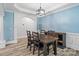 Elegant dining room with stylish chandelier, wainscoting and archway at 1009 Jerry Ln, Matthews, NC 28105