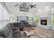 Spacious living room with vaulted ceilings, stone fireplace, and abundant natural light at 1009 Jerry Ln, Matthews, NC 28105