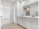 Bathroom with double sink vanity, a mirror, and tile floors at 1074 Bull Dog Ln, Wingate, NC 28174
