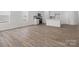 Open floor plan showcasing the kitchen and living room with wood-look floors at 1074 Bull Dog Ln, Wingate, NC 28174