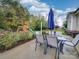 Spacious backyard with patio, dining set, and a play structure, ideal for Gathering activities at 1209 Pressley Downs Se Dr, Concord, NC 28025