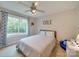Bright bedroom with large window, neutral tones, and comfortable furnishings, perfect for relaxation at 1209 Pressley Downs Se Dr, Concord, NC 28025