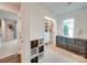 Bright bedroom with built-in storage, large window, and neutral colors, creating a cozy atmosphere at 1209 Pressley Downs Se Dr, Concord, NC 28025