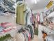Walk-in closet with ample storage, shelving, and hanging space for clothes and accessories at 1209 Pressley Downs Se Dr, Concord, NC 28025