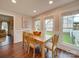 Cozy dining room with hardwood floors, natural light, and stylish décor perfect for gatherings at 1209 Pressley Downs Se Dr, Concord, NC 28025