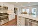 A view of the kitchen and dining room offers great sightlines for entertaining and socializing at 1209 Pressley Downs Se Dr, Concord, NC 28025