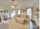 Inviting living room with hardwood floors, neutral tones, and ample natural light at 1209 Pressley Downs Se Dr, Concord, NC 28025