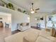 Spacious living room featuring hardwood floors, stylish decor, and an open layout at 1209 Pressley Downs Se Dr, Concord, NC 28025
