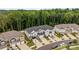 Aerial view of townhome exteriors showing garages and driveways at 12205 Gambrell Dr, Charlotte, NC 28278
