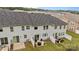 Aerial view of townhome exterior showing patios and green space at 12205 Gambrell Dr, Charlotte, NC 28278