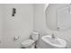 Powder room with modern fixtures, a pedestal sink, and neutral paint at 12205 Gambrell Dr, Charlotte, NC 28278
