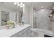 Modern bathroom with a glass-enclosed shower, sleek vanity, and neutral color palette at 12205 Gambrell Dr, Charlotte, NC 28278